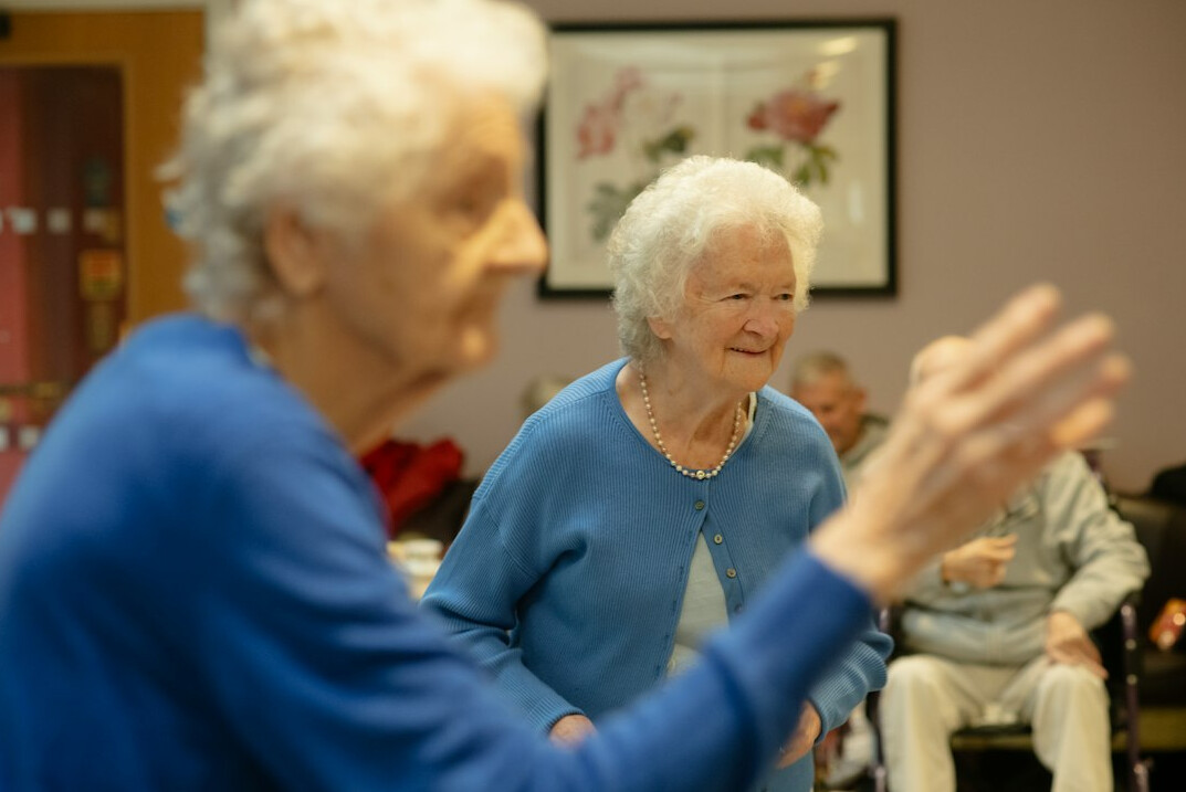 elderly doing gentle yoga