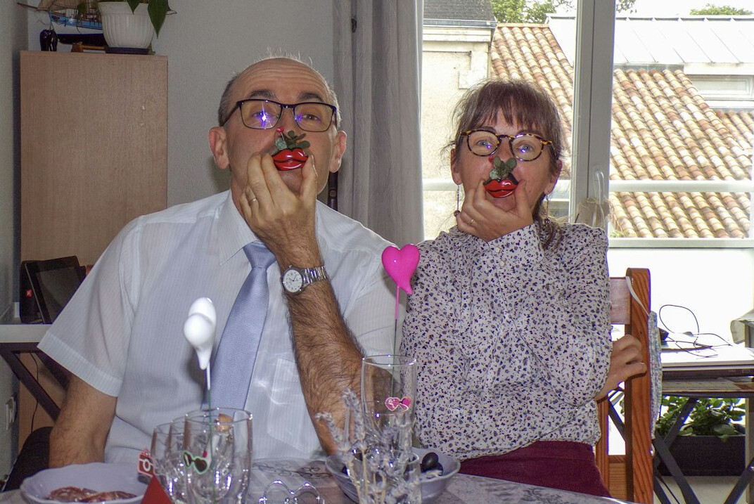 senior friends laughing at table