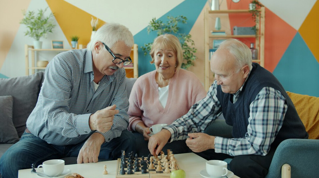 elderly people playing board games