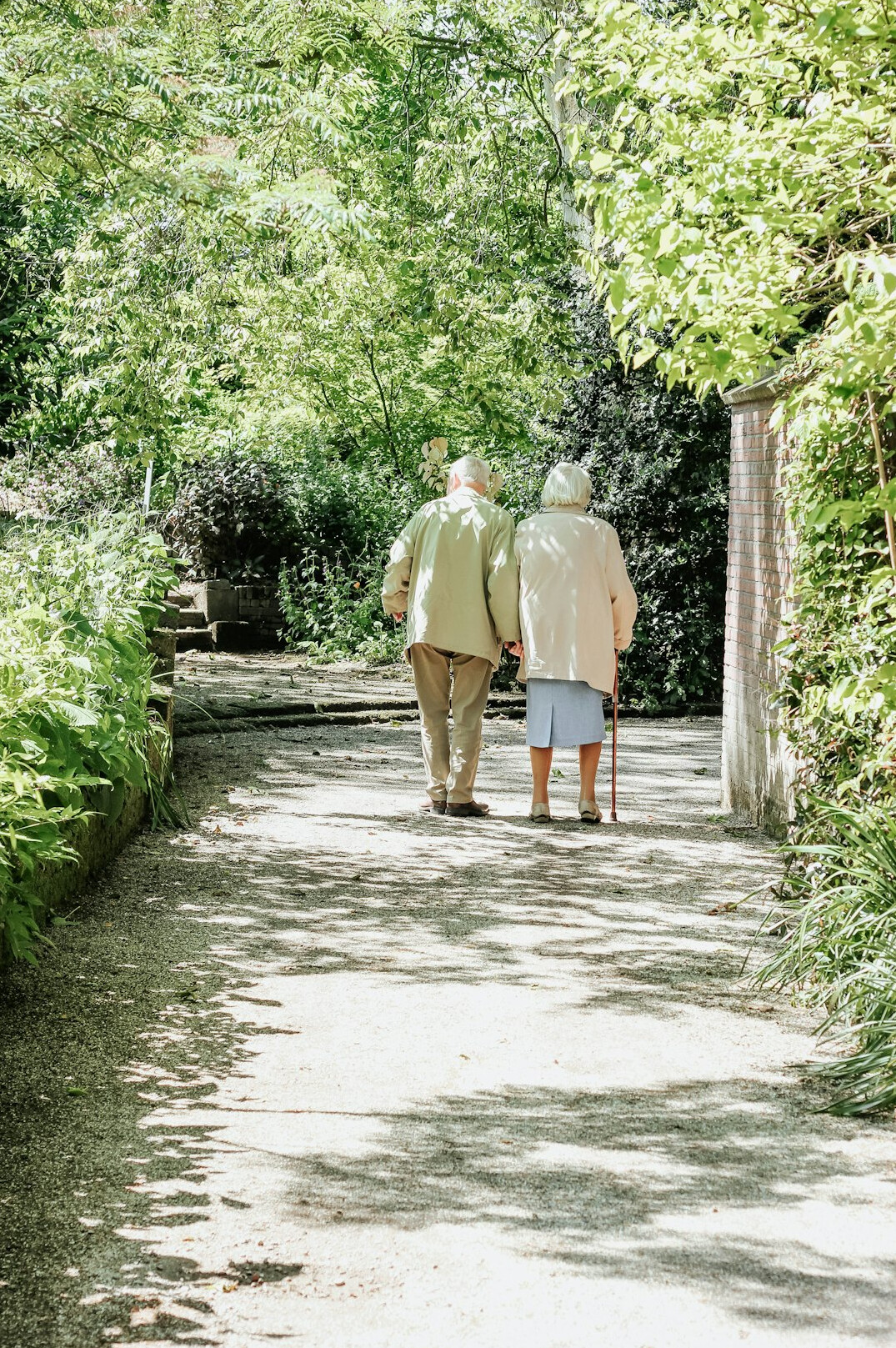 seniors walking in park together